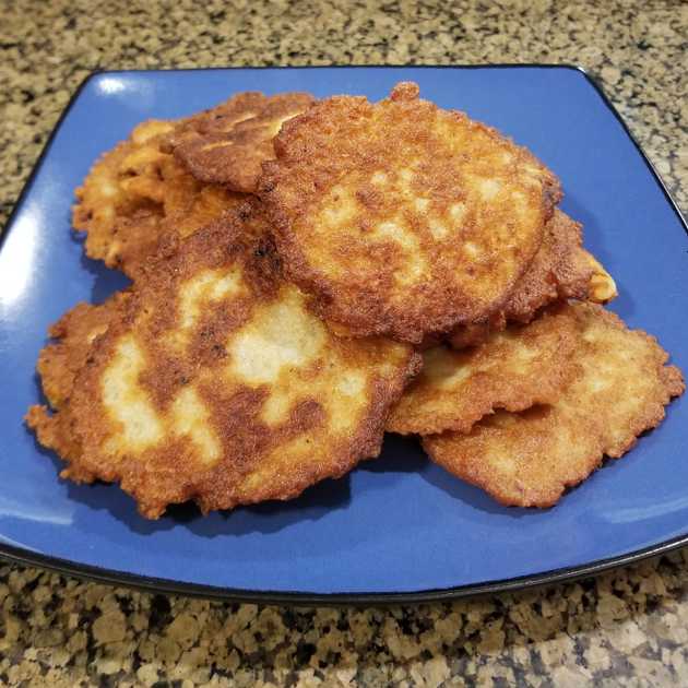 Latkes stacked on a plate