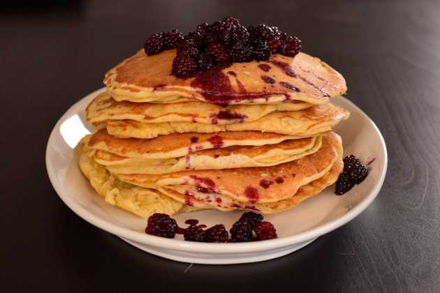 Stack of pancakes with blackberry compote