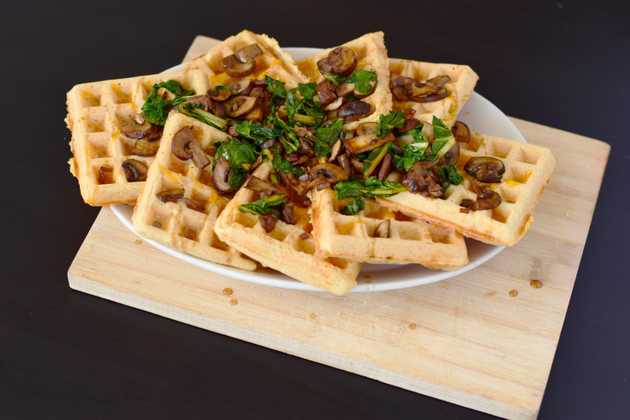 beer cheese waffles topped with sautéed shallots, mushrooms, and swiss chard